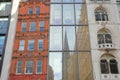 Colorful facades of buildings on Fenchurch Street in the financial district of the City of London with reflections of Saint Marga
